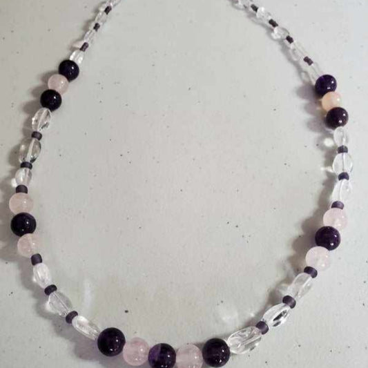 Gemstone necklace featuring amethyst and rose quartz beads with clear glass accents and lobster claw clasp