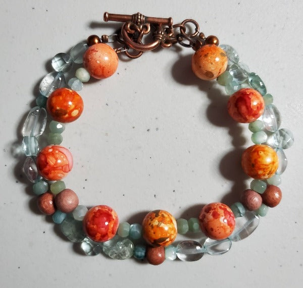 Aquamarine and orange multi-strand bracelet