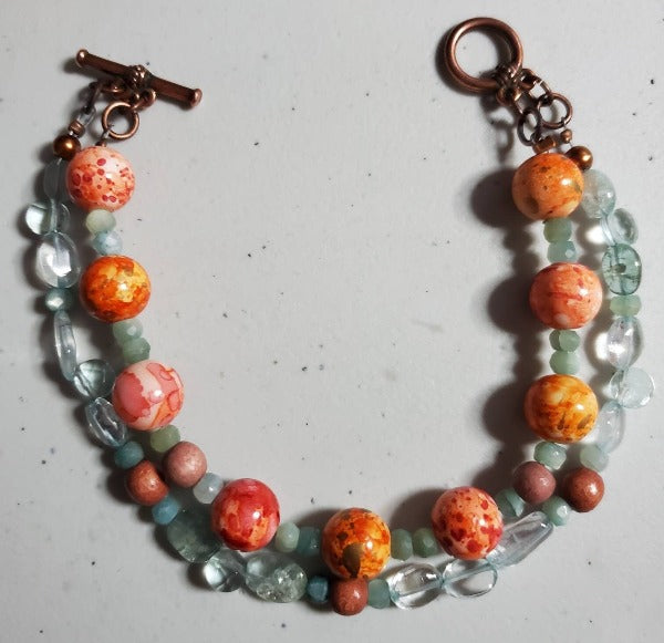 Aquamarine and orange multi-strand bracelet