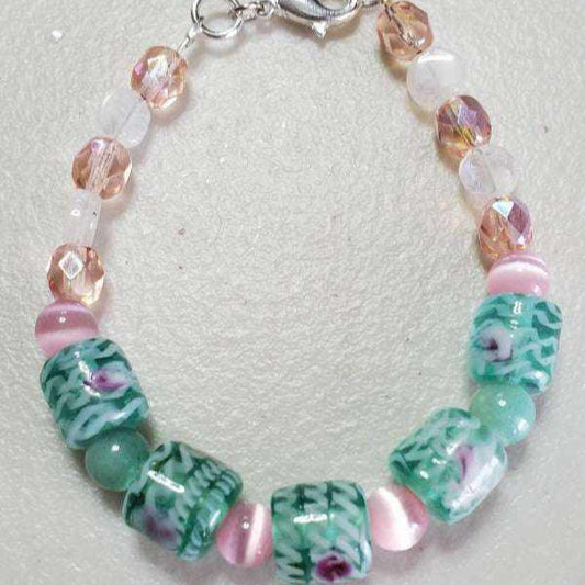 Handcrafted pink and green gemstone bracelet with jade, glass, and cat's eye beads and lobster claw clasp
