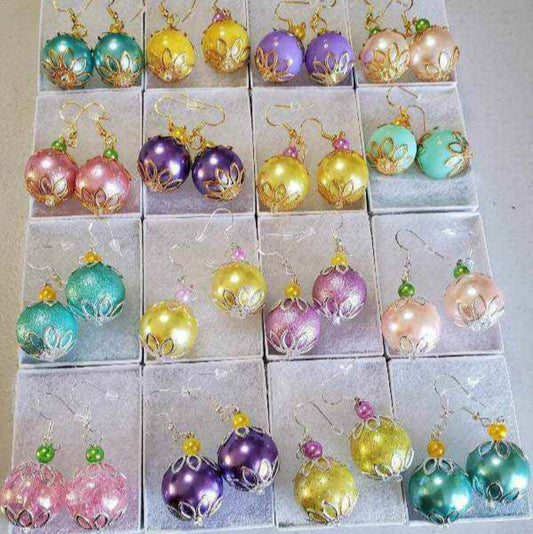Colorful drop earrings with pastel gumball beads, filigree bead caps, and glass pearls in various spring hues.