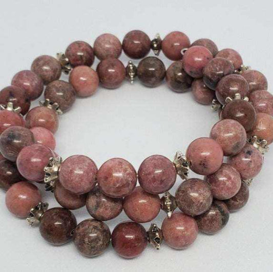 Handcrafted Rhodonite gemstone bracelet with pink and marbled beads and pewter spacers on flexible memory wire cuff design