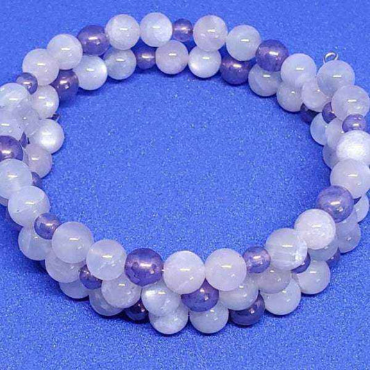 Rainbow Moonstone gemstone bracelet with purple and white beads on memory wire cuff
